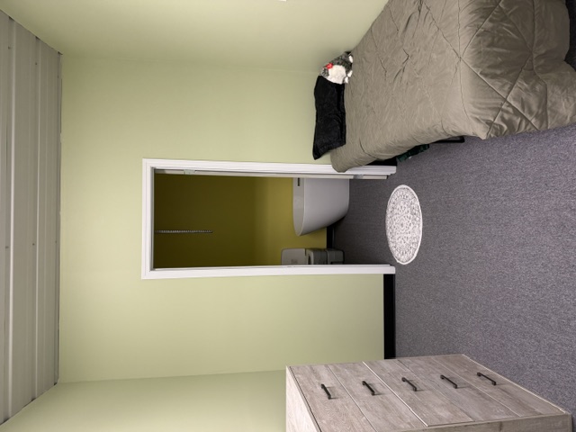 Sharalife private rest room with single bed, dresser, and adjoining bathroom